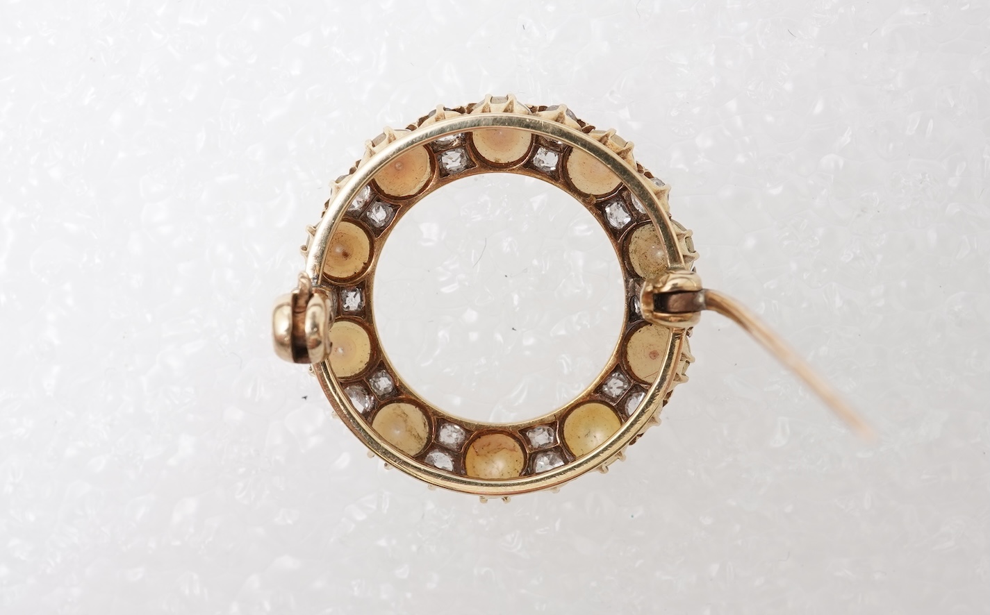 A late Victorian split pearl and diamond brooch, circa 1900